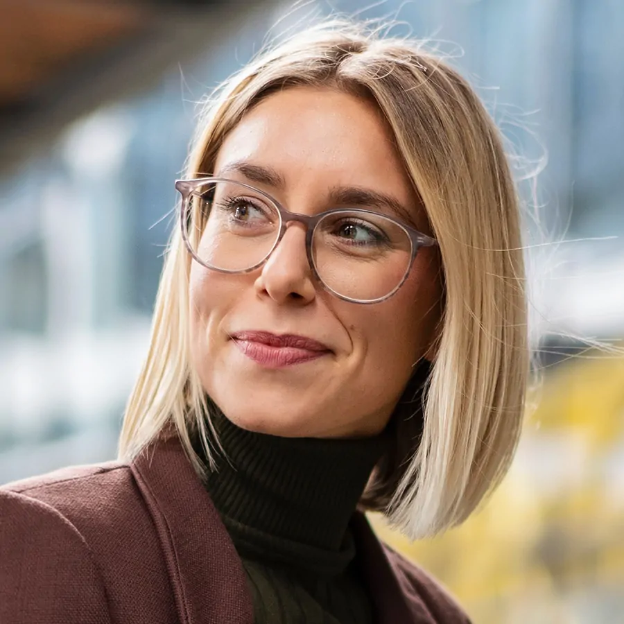 smiling young businesswoman with notebook in the c APEY22T