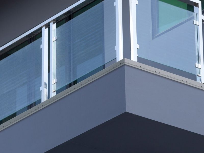 Balcony tile trim application for exposed outdoor-facing tile edges